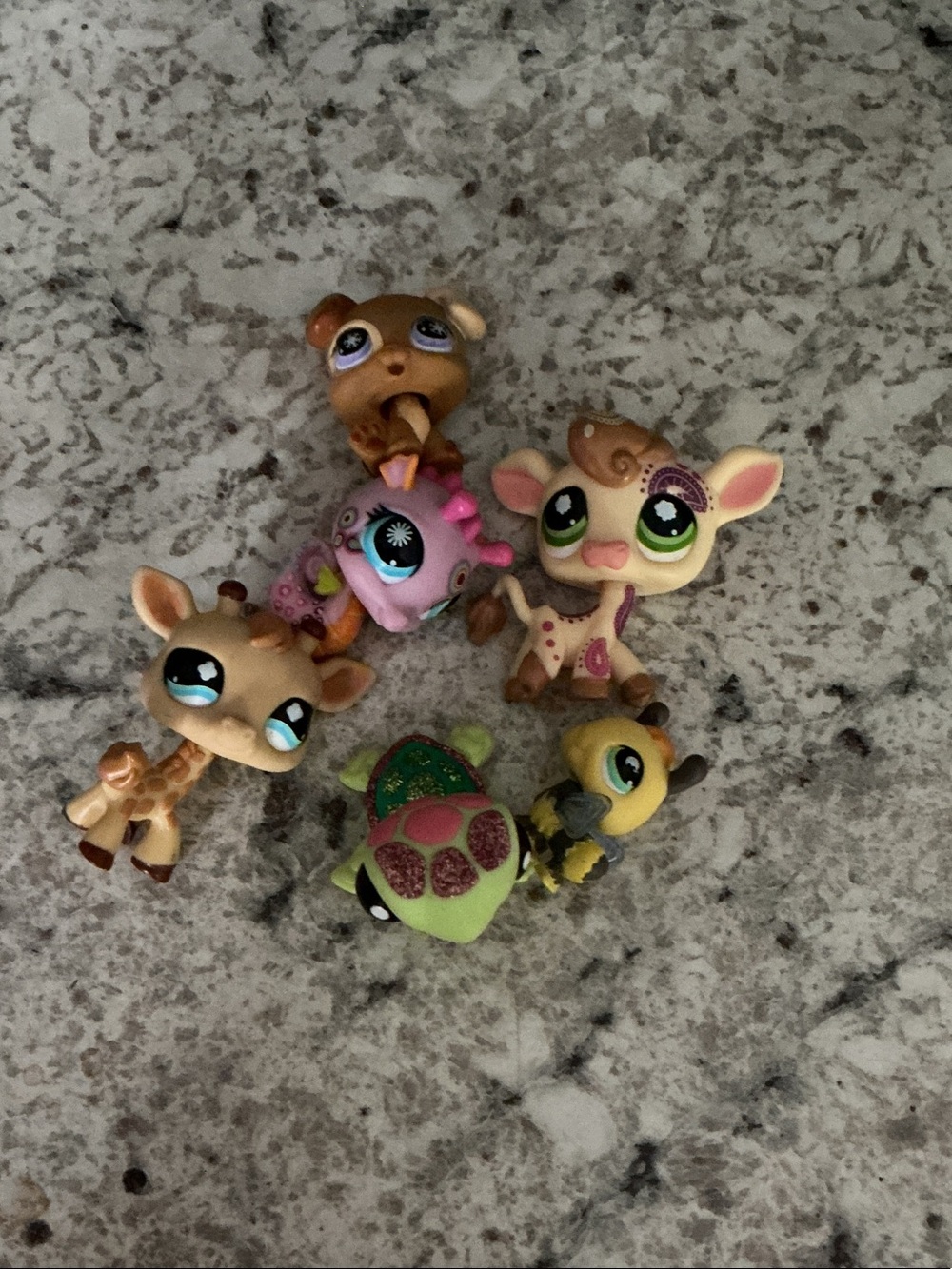 Assorted Cute Animal Toy Figures in Brown, Pink, Green, Yellow